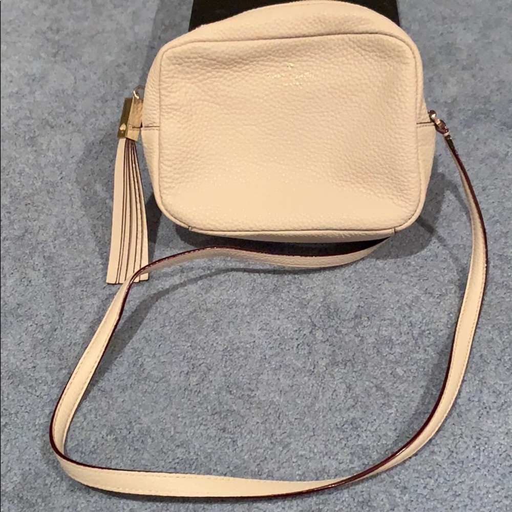 Kate Spade small cream cross body bag with tassel